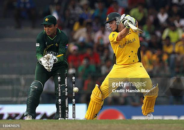 Steven Smith of Australia is bowled by Shahid Afridi of Pakistan with Kamran Akmal of Pakistan looking on during the 2011 ICC World Cup Group A match...
