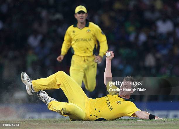 Brett Lee of Australia takes a catch from his own bowling to dismiss Mohammad Hafeez of Pakistan during the 2011 ICC World Cup Group A match between...