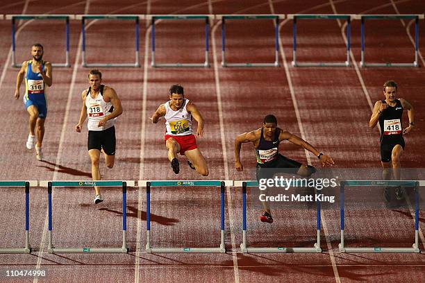 Justin Gaymon of USA leads Brendan Cole of AIS over the final hurdle in the Men's 400m Hurdles during the Sydney Track Classic at the Sydney Olympic...