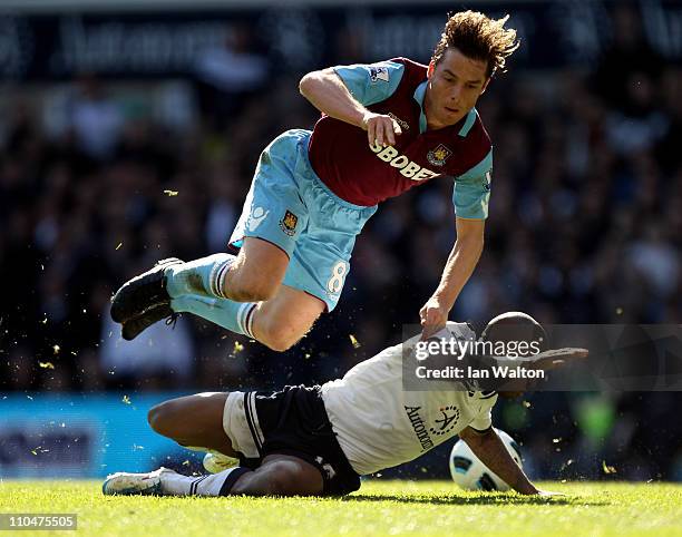 Scott Parker of West Ham tangles with Jermain Defoe of Tottenham during the Barclays Premier League match between Tottenham Hotspur and West Ham...