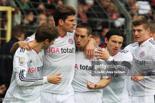 Mario Gomez of Muenchen celebrates his team's first goal with team mates Thomas Mueller, Franck Ribery Danijel Pranjic and Toni Kroos during the...