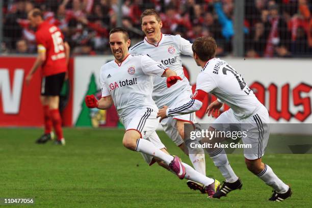 Franck Ribery of Muenchen celebrates his team's second goal with team mates Bastian Schweinsteiger and Philipp Lahm during the Bundesliga match...