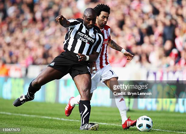 Jermaine Pennant of Stoke City battles with Sol Campbell of Newcastle United during the Barclays Premier League match between Stoke City and...