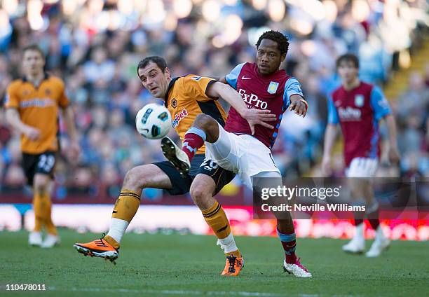 Jean II Makoun of Aston Villa challenges Nenad Milijas of Wolverhampton Wanderers during the Barclays Premier League match between Aston Villa and...
