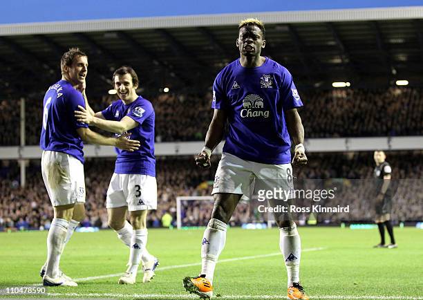 Louis Saha of Everton celebrates scoring his team's 2-0 goal during the Barclays Premier League match between Everton and Fulham at Goodison Park on...