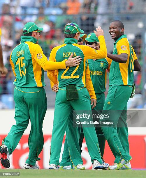 Lonwabo Tsotsobe of South Africa celebrates the wicket of Imrul Kayes of Bangladesh with his team mates during the ICC Cricket World Cup group B...