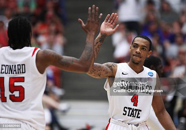 Kawhi Leonard and Malcolm Thomas of the San Diego State Aztecs celebrate during their game against the Temple Owls in the third round of the 2011...