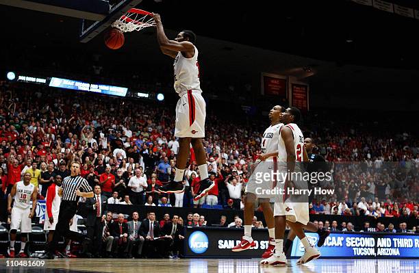 Kawhi Leonard of the San Diego State Aztecs scores the final basket in double overtime against the Temple Owls in the third round of the 2011 NCAA...
