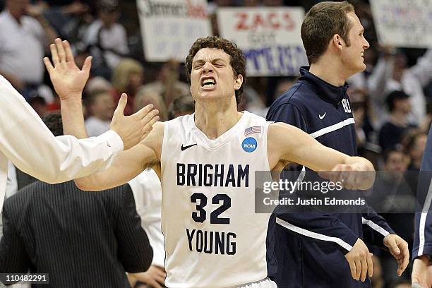 Jimmer Fredette of the Brigham Young Cougars celebrates after a play against the Gonzaga Bulldogs during the third round of the 2011 NCAA men's...