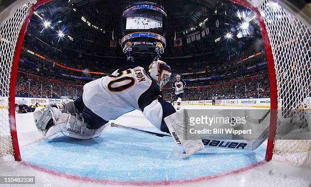 Tim Connolly of the Buffalo Sabres scores a third period goal past Chris Mason of the Atlanta Thrashers at HSBC Arena on March 19, 2011 in Buffalo,...