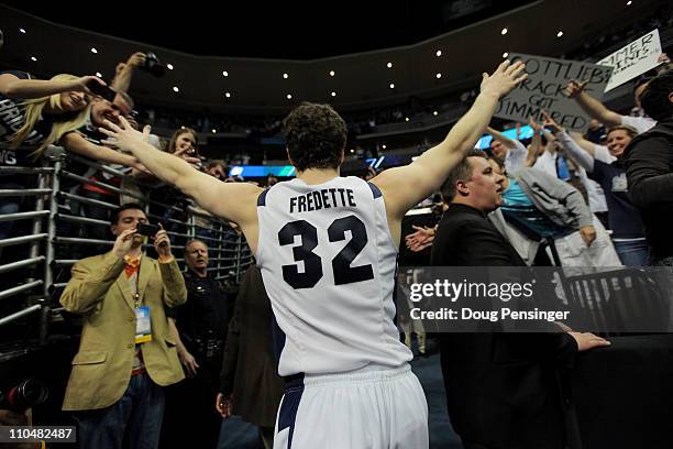 Jimmer Fredette of the Brigham Young Cougars runs off of the court after defeating the Gonzaga Bulldogs during the third round of the 2011 NCAA men's...