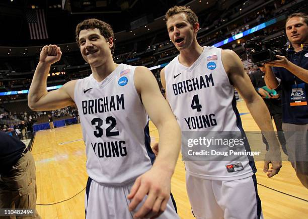 Jimmer Fredette and Jackson Emery of the Brigham Young Cougars walk off of the court after defeating the Gonzaga Bulldogs during the third round of...