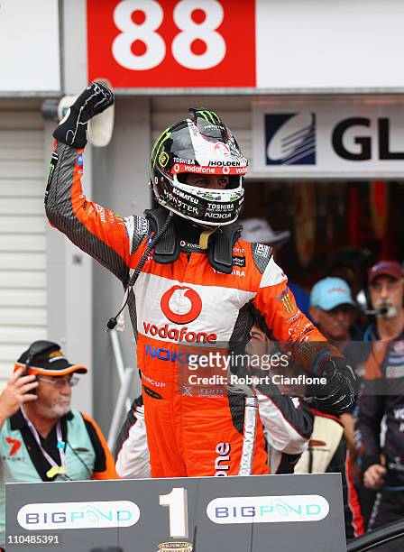 Jamie Whincup driver of the Team Vodafone Holden celebrates after winning race four of the Clipsal 500, which is round two of the V8 Supercar...