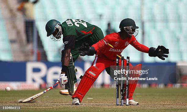 Tatenda Taibu of Zimbabwe celabrates, as Collins Obuya of Kenya is run out by Vusi Sibanda of Zimbabwe during the ICC World Cup match between Kenya...