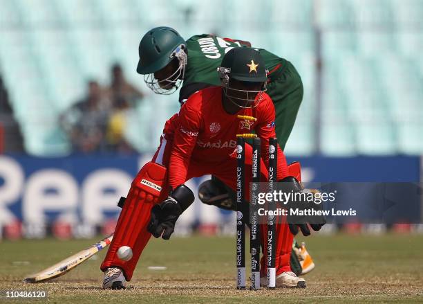 Tatenda Taibu of Zimbabwe celabrates, as Collins Obuya of Kenya is run out by Vusi Sibanda of Zimbabwe during the ICC World Cup match between Kenya...