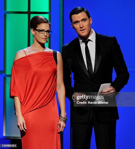 Actors Amanda Righetti and Owain Yeoman speak onstage at the 25th Anniversary Genesis Awards at the Century Plaza Hotel on March 19, 2011 in Los...