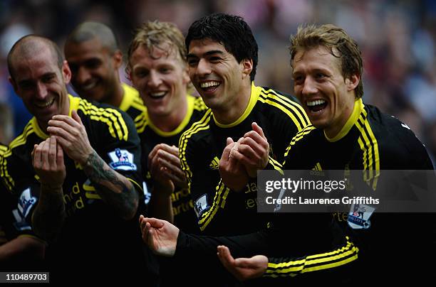 Luis Suarez of Liverpool celebrates his goal alongside Lucas Leiva, Dirk Kuyt and Raul Meireles during the Barclays Premier League match between...