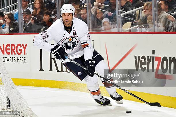 Jason Strudwick of the Edmonton Oilers skates with the puck against the Pittsburgh Penguins on March 13, 2011 at CONSOL Energy Center in Pittsburgh,...