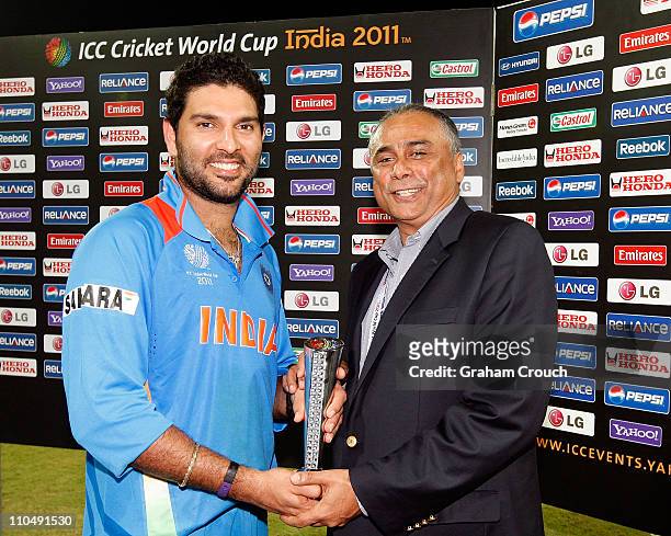 Yuvraj Singh of India is awarded Man of the Match for the Group B ICC World Cup match between India and West Indies at M. A. Chidambaram Stadium on...