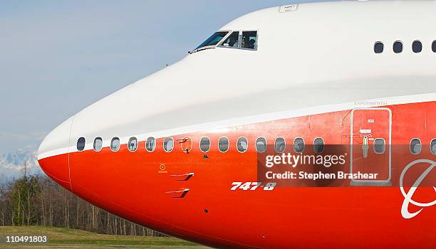 The Boeing 747-8 Intercontinental airliner, the company's newest and largest passenger plane, taxis down a runway before it takes off for its first...