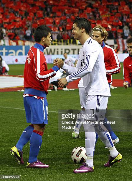 Cristiano Ronaldo of Real Madrid shakes hands with Sergio Aguero of Atletico during the La Liga match between Atletico Madrid and Real Madrid at...