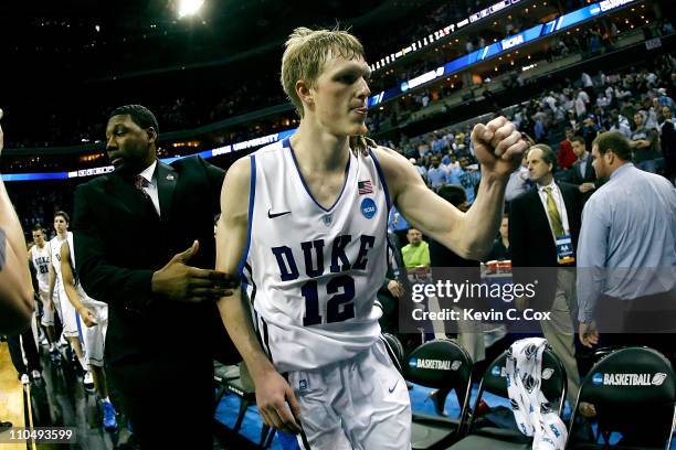 Kyle Singler of the Duke Blue Devils reacts after the Blue Devils defeated the Michigan Wolverines 73-71 during the third round of the 2011 NCAA...