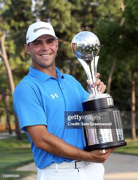 Gary Woodland poses with the trophy after winning the Transitions Championship at Innisbrook Resort and Golf Club on March 20, 2011 in Palm Harbor,...