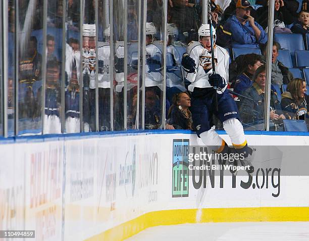 Blake Geoffrion of the Nashville Predators jumps into the boards to celebrate his third goal of the game against the Buffalo Sabres at HSBC Arena on...