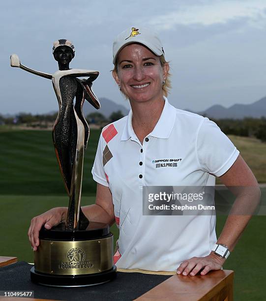 Karrie Webb of Australia poses with the championship trophy after the final round of the RR Donnelley LPGA Founders Cup at Wildfire Golf Club on...