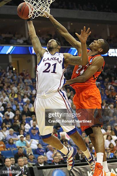Markieff Morris of the Kansas Jayhawks goes up for a shot against Mike Davis of the Illinois Fighting Illini during the third round of the 2011 NCAA...