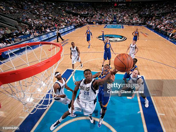 Ian Mahinmi of the Dallas Mavericks rebounds against the Golden State Warriors during a game on March 20, 2011 at the American Airlines Center in...