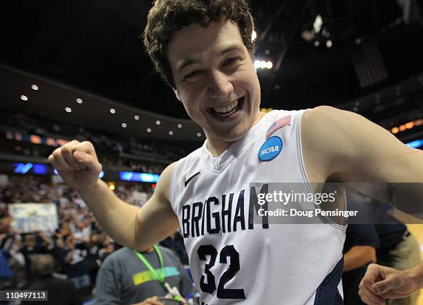 Jimmer Fredette of the Brigham Young Cougars walks off of the court after defeating the Gonzaga Bulldogs during the third round of the 2011 NCAA...