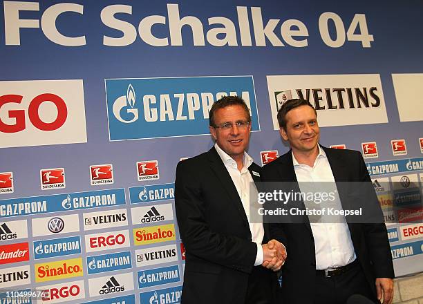 Manager Horst heldt of Schalke welcomes new head coach Ralf Rangnick during a press conference at the Veltins Arena on March 21, 2011 in...