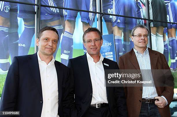 Manager Horst Heldt, new head coach Ralf Rangnick and member of the board, Peter Peters, pose prior to a press conference at the Veltins Arena on...