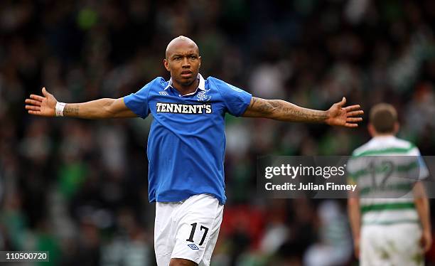 El Hadji Diouf of Rangers celebrates in front of the Rangers fans during the Co-operative Insurance Cup final between Celtic and Rangers at Hampden...