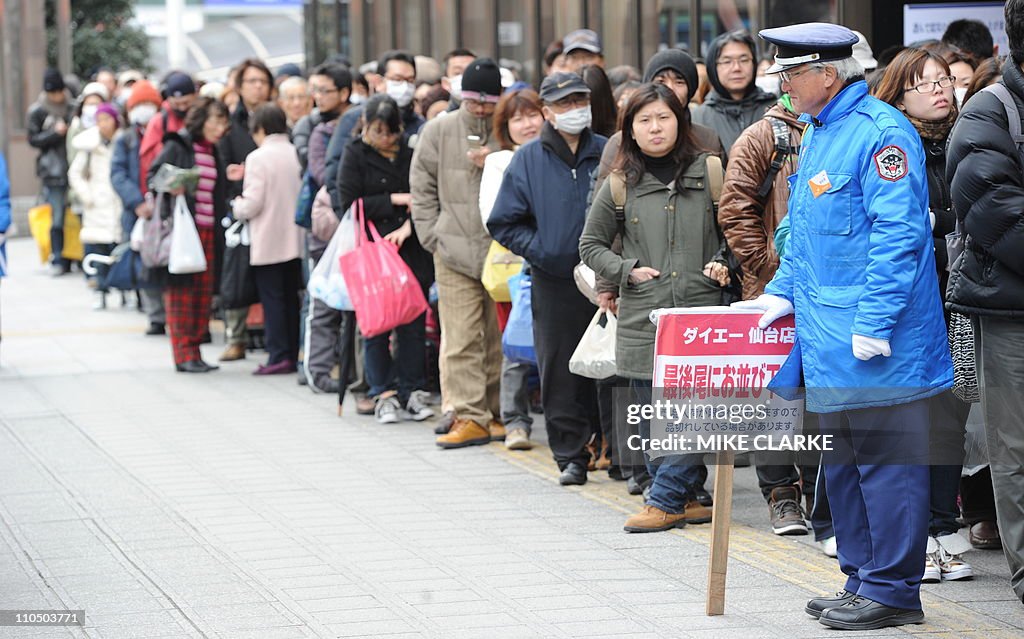 People queue outside a supermarket in Se