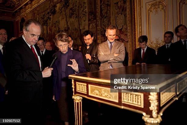 Frederic Mitterrand and Beatrix Saule instate the desk of Marie-Antoinette at Chateau de Versailles on March 21, 2011 in Versailles, France.