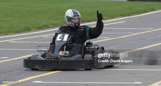 Ben Foden, the Northampton Saints and England fullback gives the thumbs up whilst driving on a go-kart during the Northampton Saints media day on...