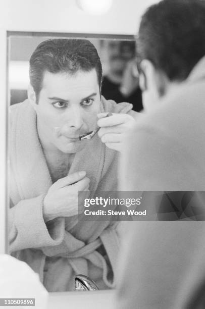 Queen frontman Freddie Mercury shaving his moustache, 12th April 1984.