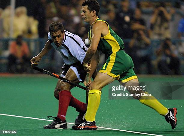Jamie Dwyer of Australia battles with Michael Green of Germany during the World Cup Hockey final between Australia and Germany held at the Bukit...