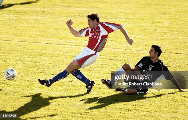 Joel Porter of the Melbourne Knights avoids a challenge from Ante Deur of Sydney Olympic, during the Round 22 NSL match between the Melbourne Knights...