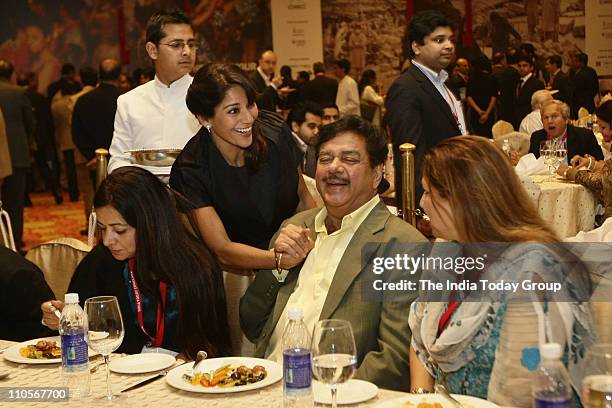 Leader and veteran actor Shatrughan Sinha with actor and TV host Koel Purie Rinchet at lunch on Day 2 of the India Today Conclave 2011.