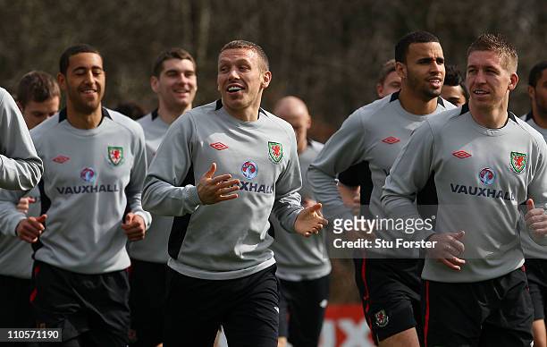 Wales striker Craig Bellamy shares a joke with team mates during Wales training at the Vale ahead of their UEFA EURO 2012 qualifier against England,...