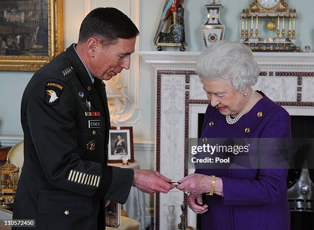 General David Petraeus meets with Queen Elizabeth II during an audience at Buckingham Palace on March 22, 2011 in London, England. General Petraeus...