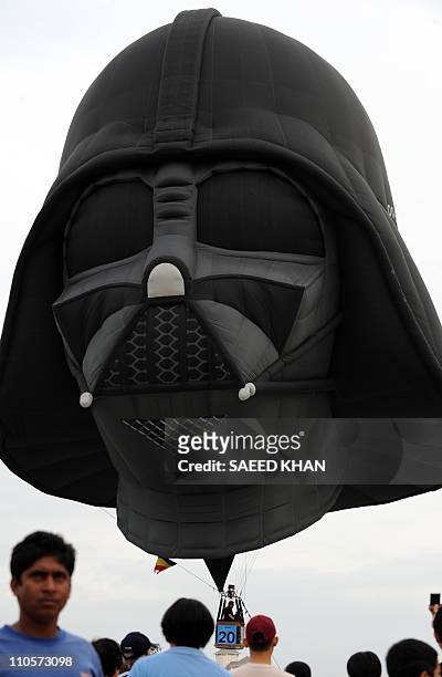 Giant balloon shaped like the head of the character Darth Vader from the Star Wars films lifts off in Malaysia's administrative capital of Putrajaya...