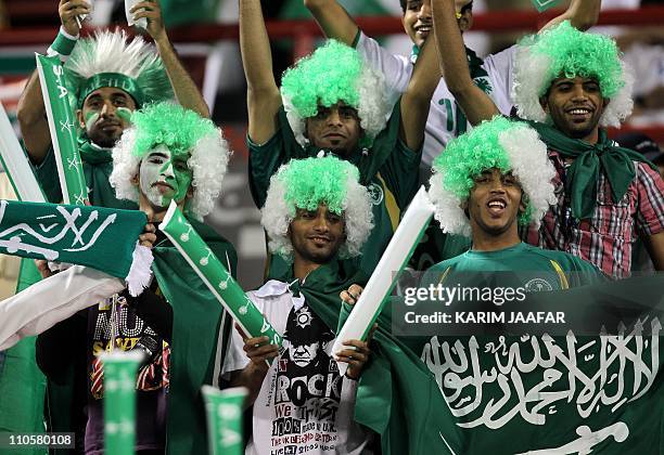 Saudi fans cheer for their team before the start of the 2011 Asian Cup group B football match between Saudi Arabia and Syria at Al-Rayyan Stadium in...