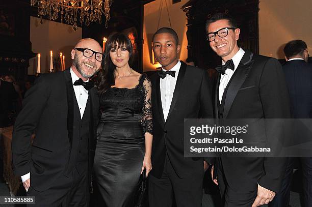 Domenico Dolce, Monica Bellucci, Pharrell Williams and Stefano Gabbana attend the Dolce&Gabbana and Martini gold dinner at the Italian Ambassador...