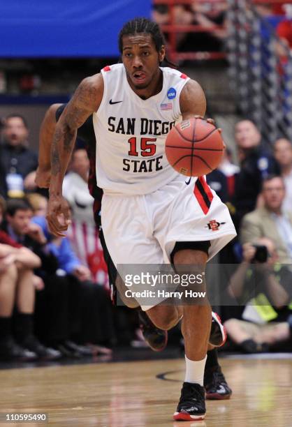 Kawhi Leonard of the San Diego State Aztecs drives against the Temple Owls during the third round of the 2011 NCAA men's basketball tournament at...