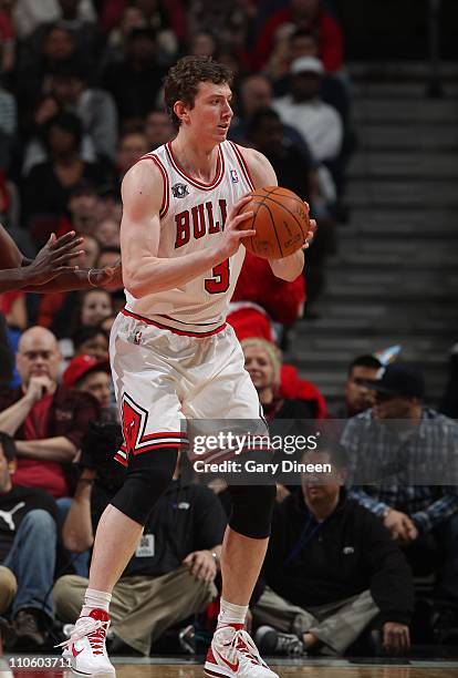 Omer Asik of the Chicago Bulls handles the ball during the game against the Sacramento Kings on March 21, 2011 at the United Center in Chicago,...