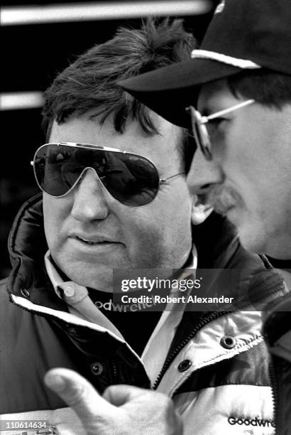 Richard Childress, owner of the Goodwrench car driven by Dale Earnhardt Sr., talks with Earnhardt prior to the start of the 1988 Daytona 500 on...